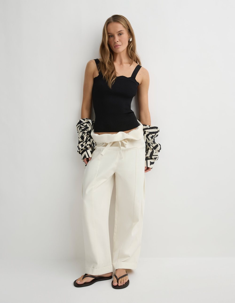 The Otto Pant in eggshell, a wide leg pant with a fold-over waistband.